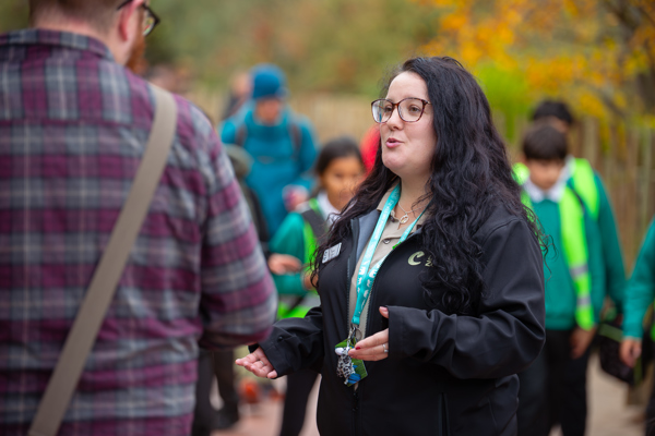 A volunteer at Chester Zoo talking to a visito