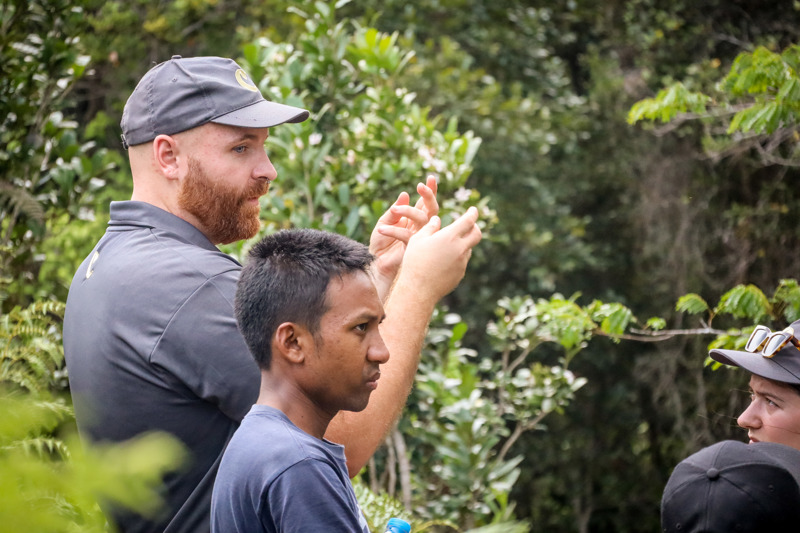 Chester Zoo and Madagasikara Voakajy team members talking in the forest