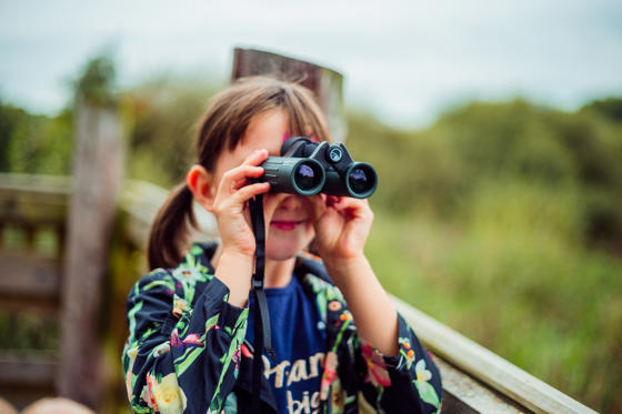 Little Girl Looking Through Binoculars
