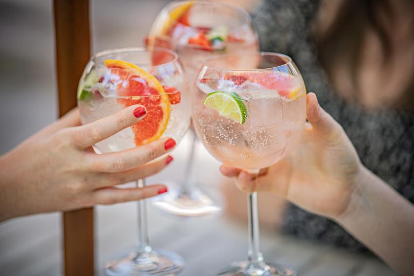 Toasting Three Glasses Of Gin