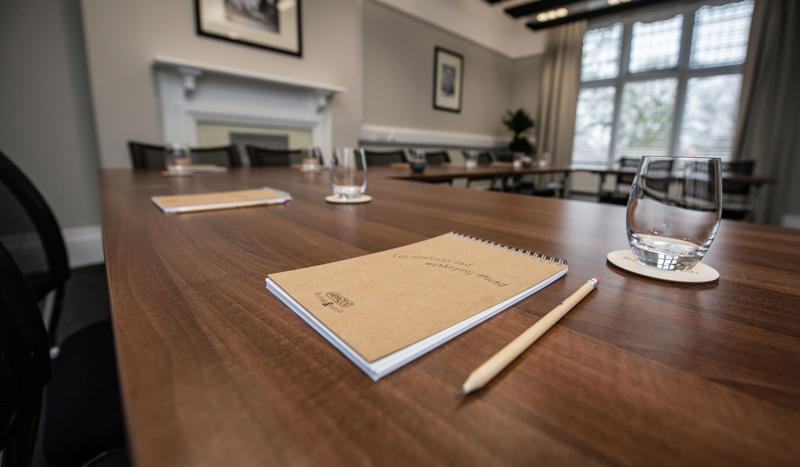 Meeting Room In The Oakfield With Notebooks And Pens