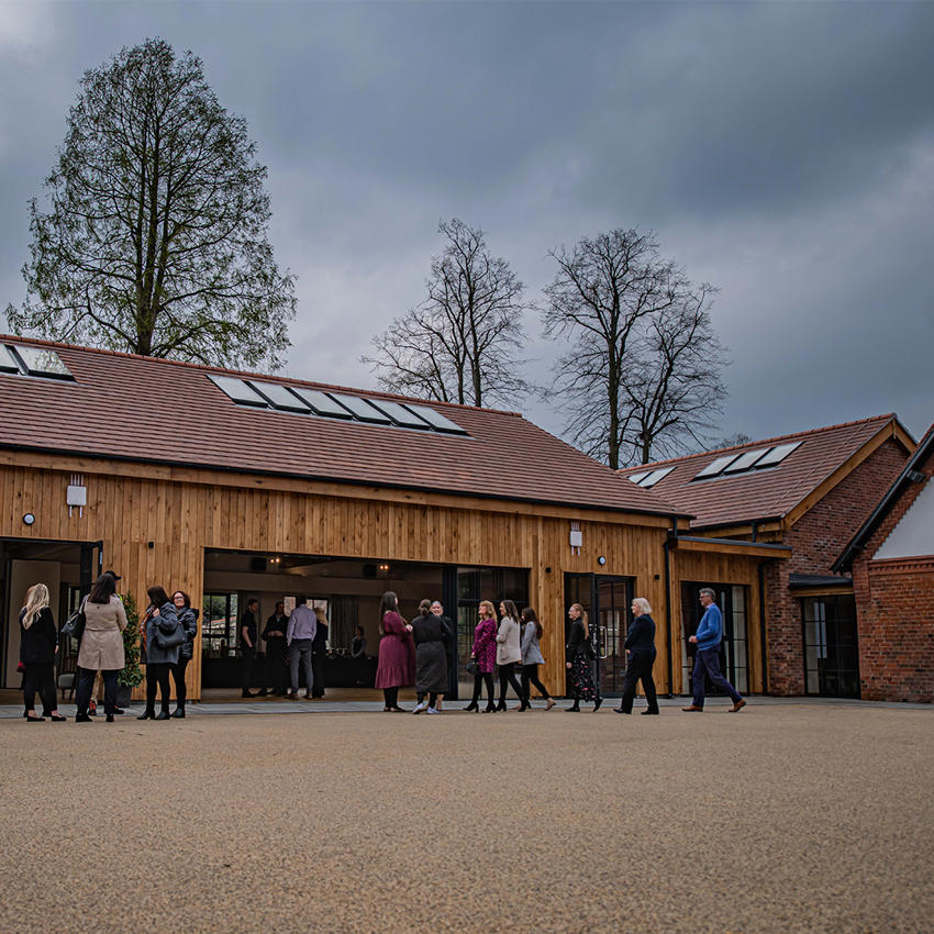 Guests Walking Into The Squares Main Hall