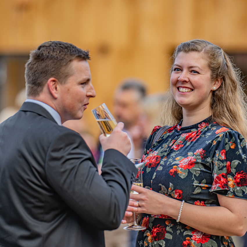 Two Guests At The Square Drinking Champagne