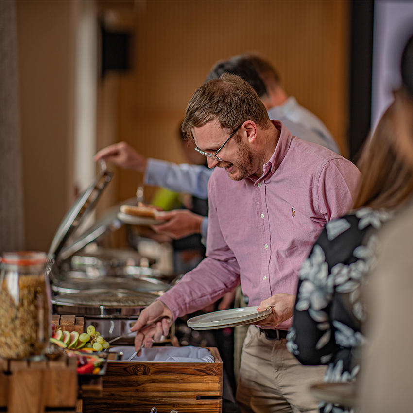 A Guest Grabbing Food At The Square